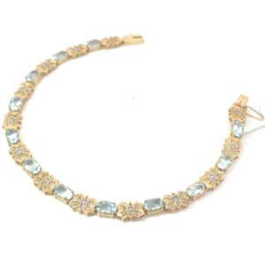 14kt yellow gold diamond and genuine aquamarine bracele with foldover safety approximate weight 4.80cts D tw 0.15pts
