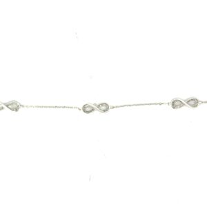 10kt white gold diamond tripple inifinity bracelet D tw 0.14cts SI clarity, near colorless I color with claw catch closure 7"