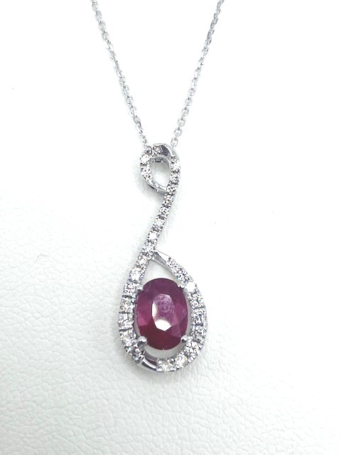 sd .jpg 14kt white gold diamond and ruby oval pendant D tw 0.23cts R tw 0.97cts on diamond cut cable 18" SI, I