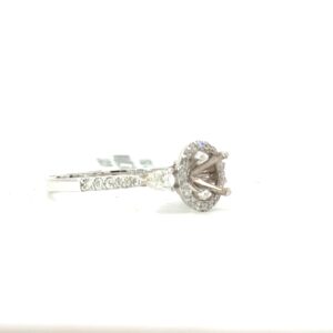 18kt white gold three stone pear shape on side and round halo semi mount tw 0.50cts SI, H color