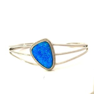 Sterling Silver rhodium plated created blue opal beaded halo inlay open cuff