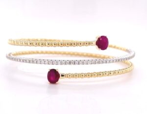 14kt yellow gold diamond and ruby flexible bypass bracelet R tw 1.38cts D tw 0.57cts